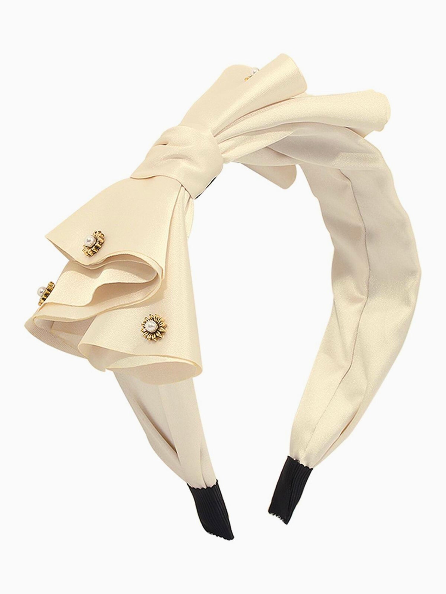 Cream-colored bow headband with decorative bow and rhinestone accents for elegant gowns