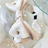 Delicate white bow headband with jewels ideal for a gown or grand bow sash styling.